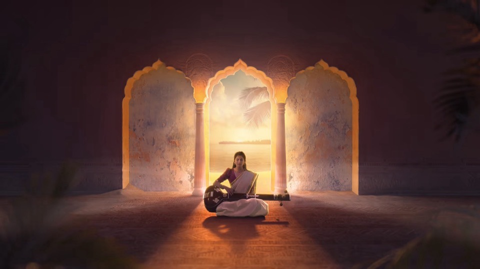 A singer seated inside a carved temple, lit warm by the setting sun through the middle archway.
